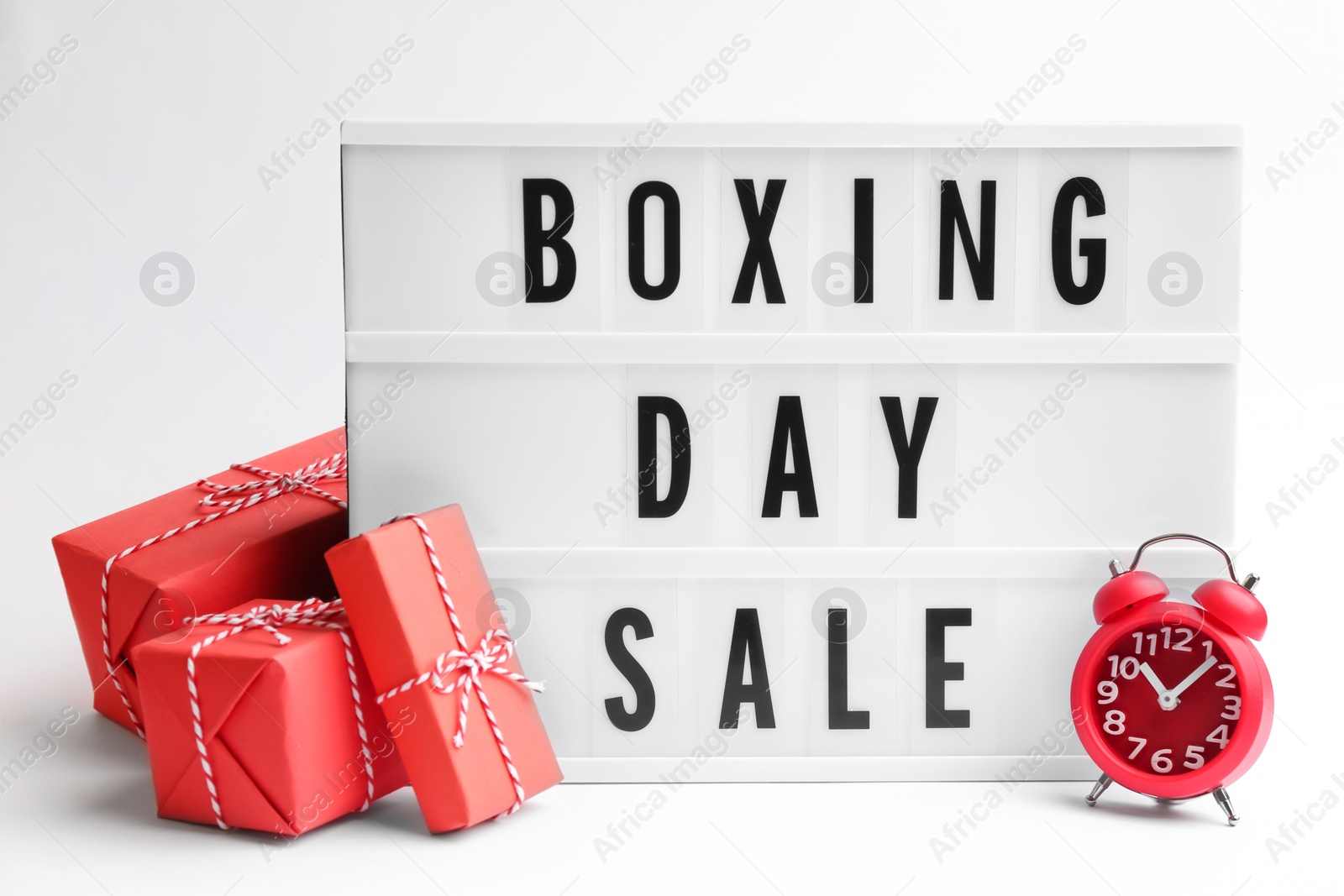 Photo of Lightbox with phrase BOXING DAY SALE and Christmas decorations on white background