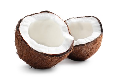 Photo of Halves of fresh ripe coconut on white background