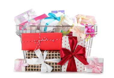 Metal shopping basket with different gifts on white background