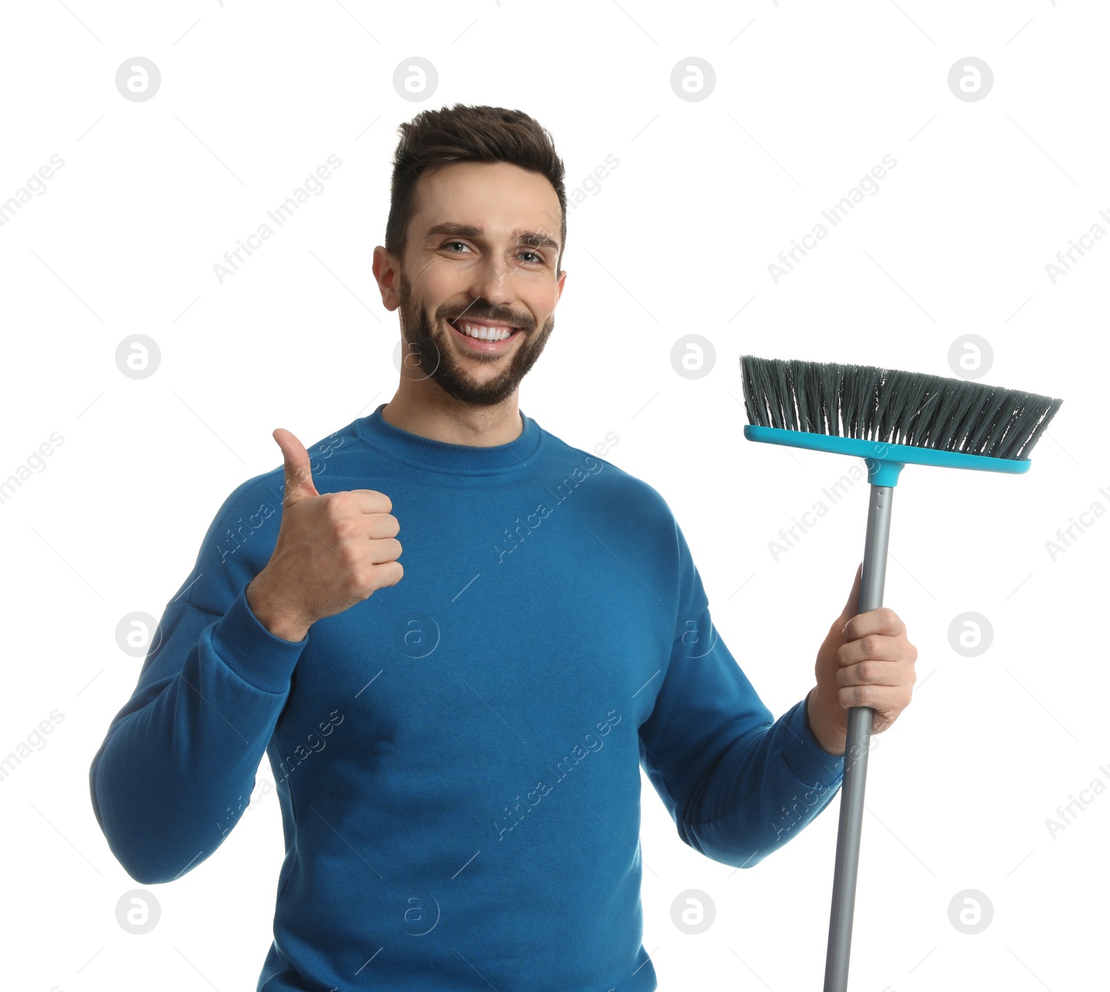 Photo of Handsome man with broom on white background