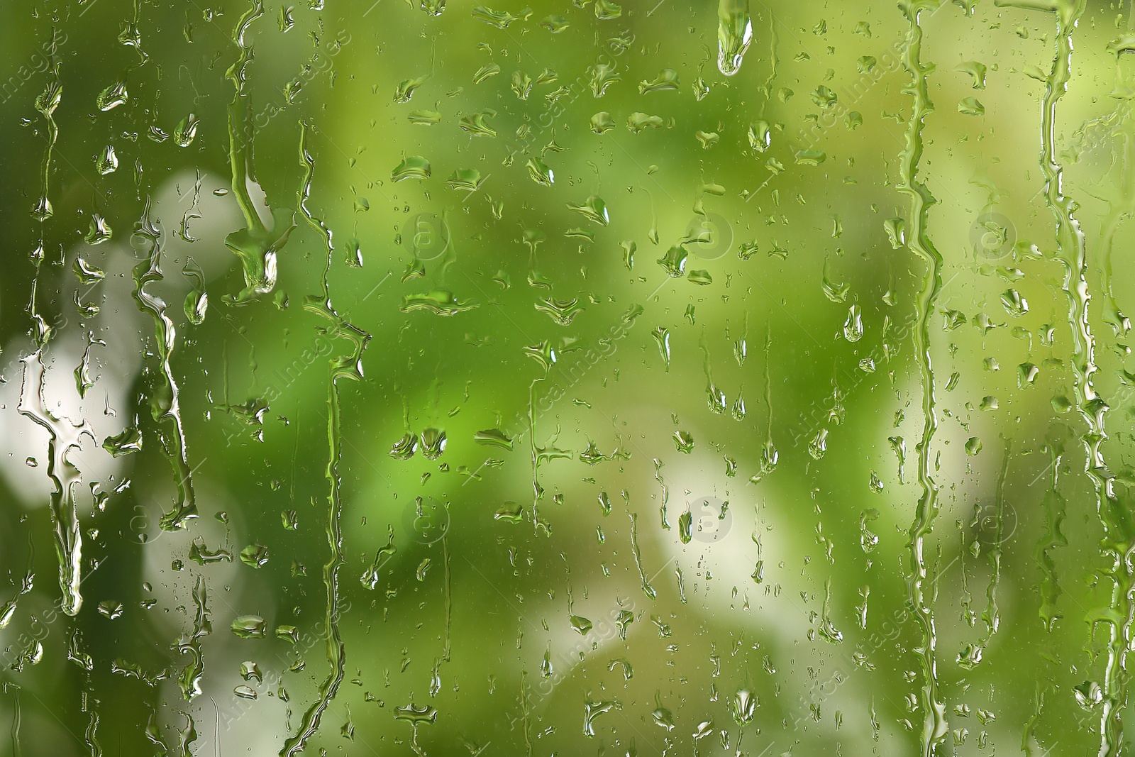 Photo of View of glass with water drops, closeup