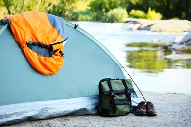 Photo of Sleeping bag and other camping gear outdoors