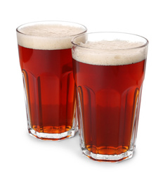 Glasses of delicious kvass on white background