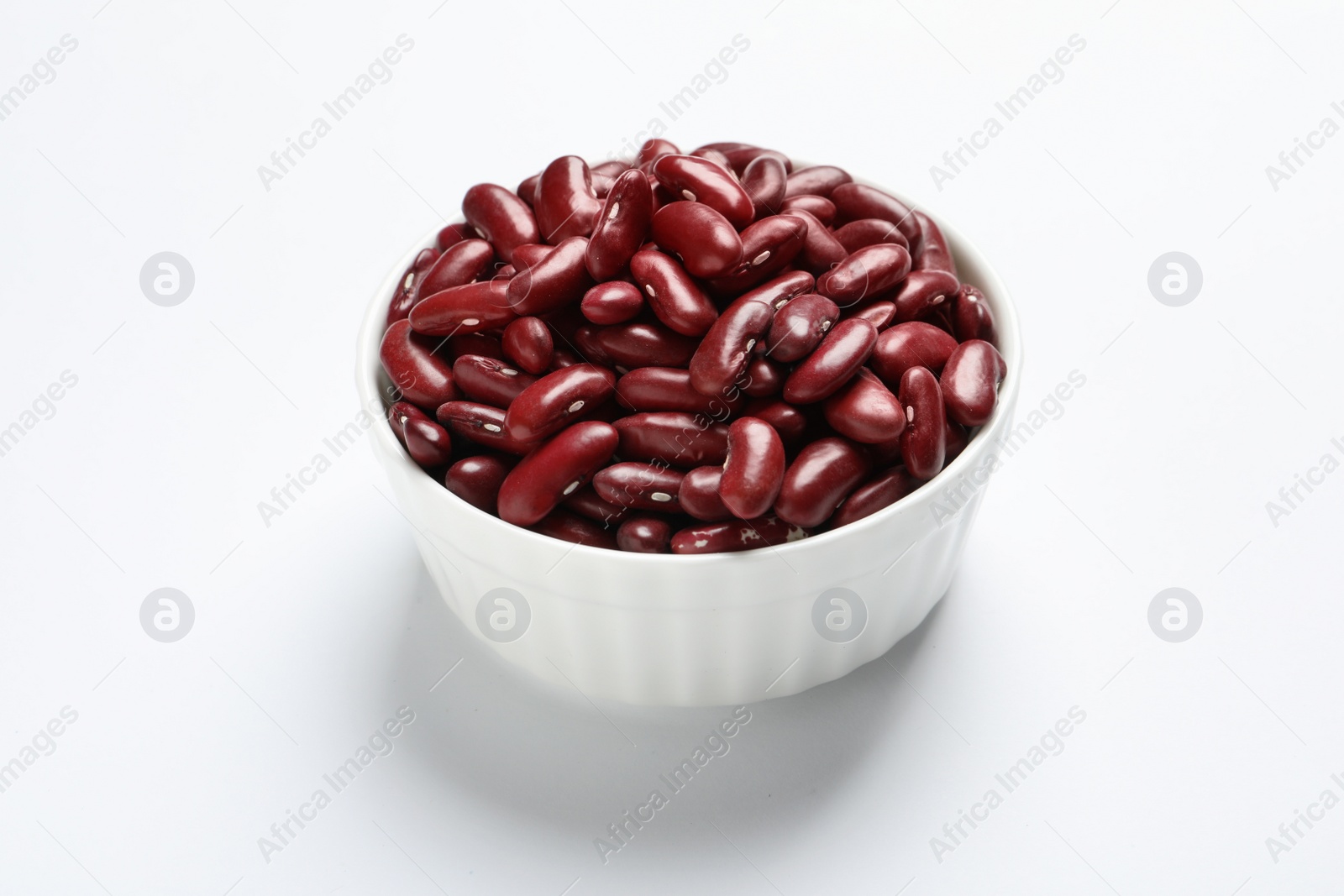 Photo of Bowl with beans on white background. Natural food high in protein