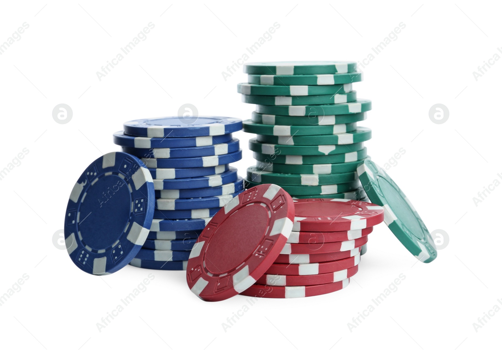 Photo of Plastic casino chips stacked on white background. Poker game