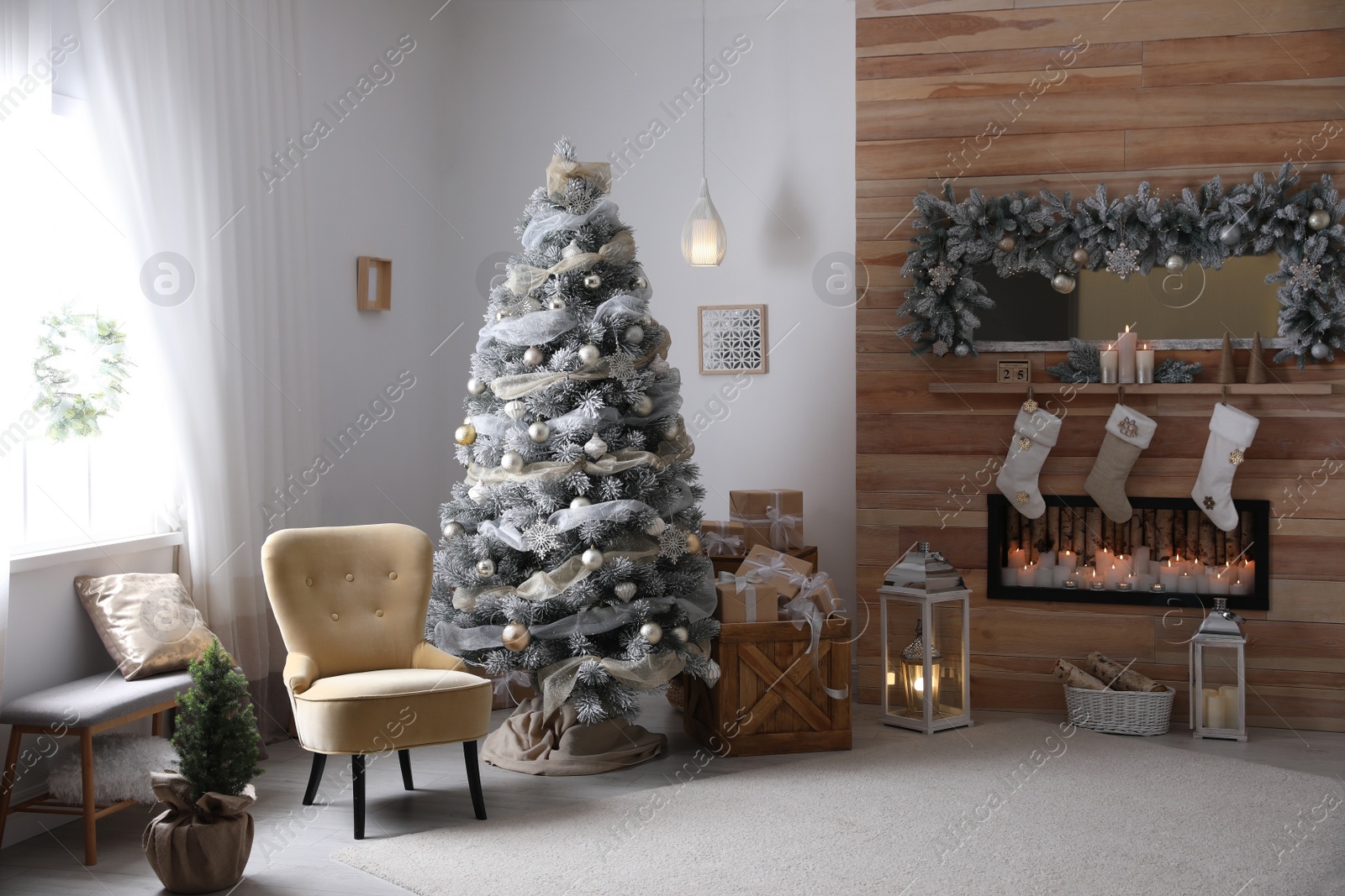 Photo of Festive interior with beautiful Christmas tree and gifts