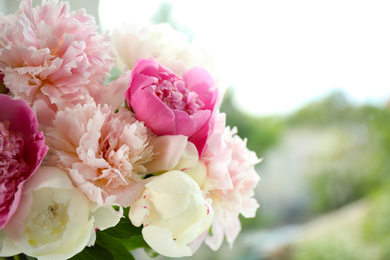 Photo of Beautiful peony bouquet on blurred background, closeup