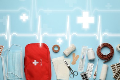First aid kit and illustration of heartbeat rate with symbols cross on light blue background, flat lay