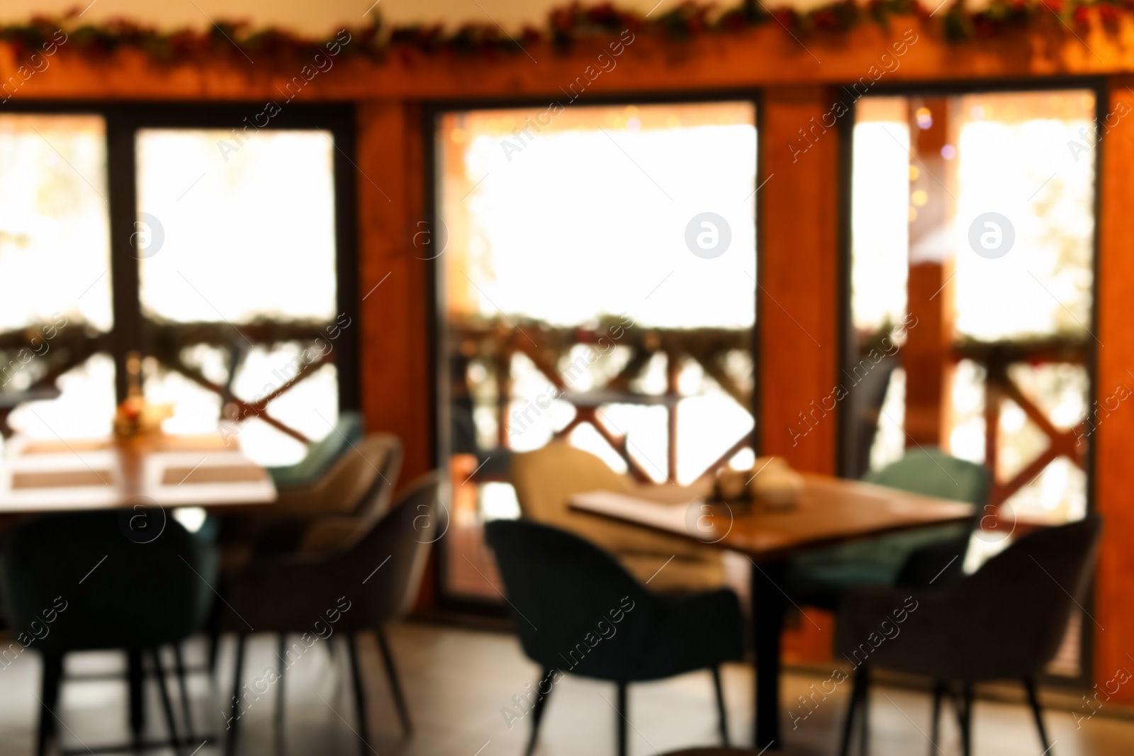 Photo of Blurred view of modern cafe interior with new stylish furniture