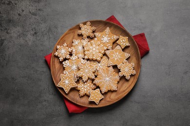 Photo of Tasty Christmas cookies on grey table, top view