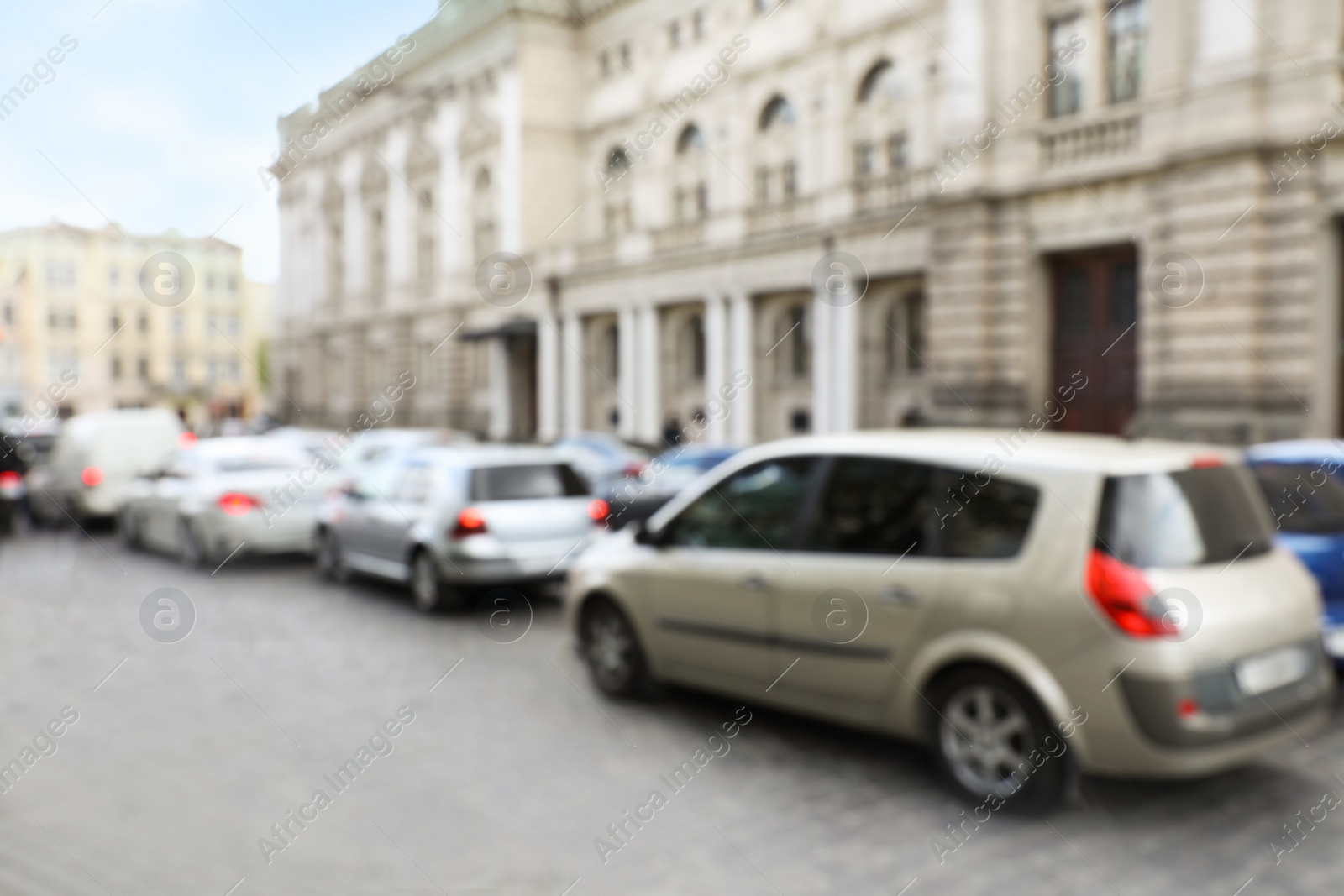 Photo of Blurred view of cars in traffic jam on city street