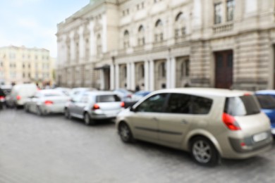 Photo of Blurred view of cars in traffic jam on city street