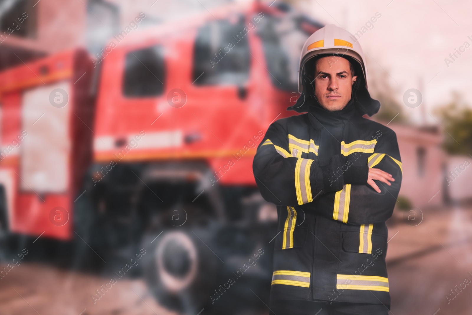 Image of Rescuer wearing uniform and helmet. Professional firefighter