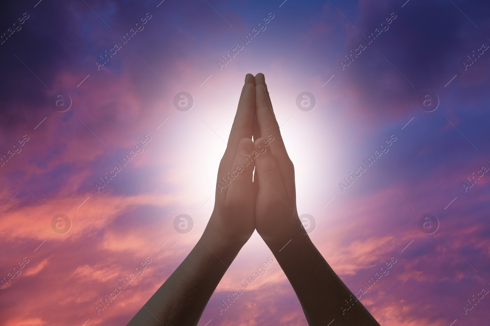 Image of Religion. Christian man praying against sky, closeup