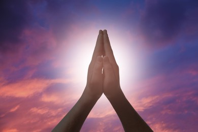 Image of Religion. Christian man praying against sky, closeup