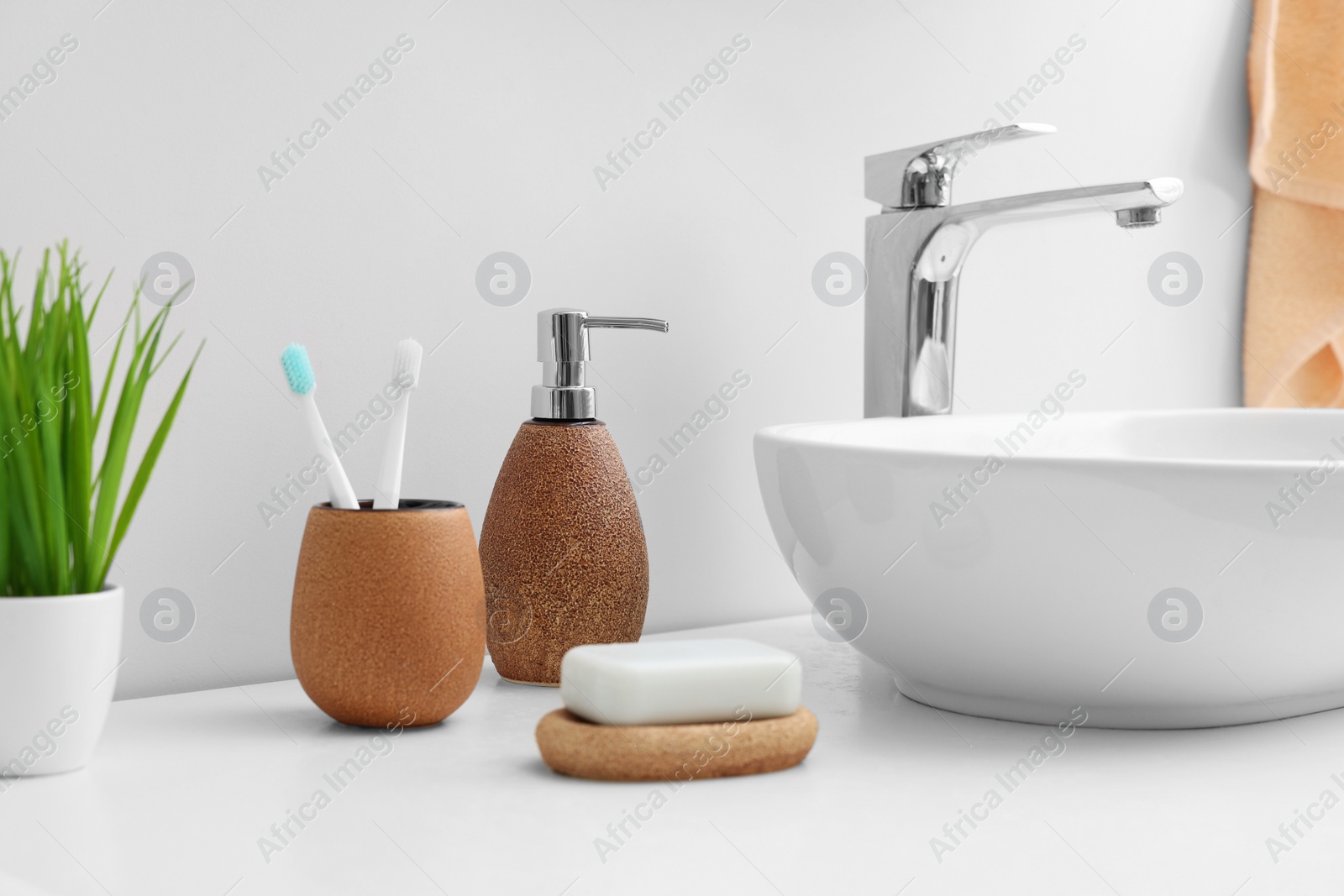 Photo of Set of different bath accessories and products on white table