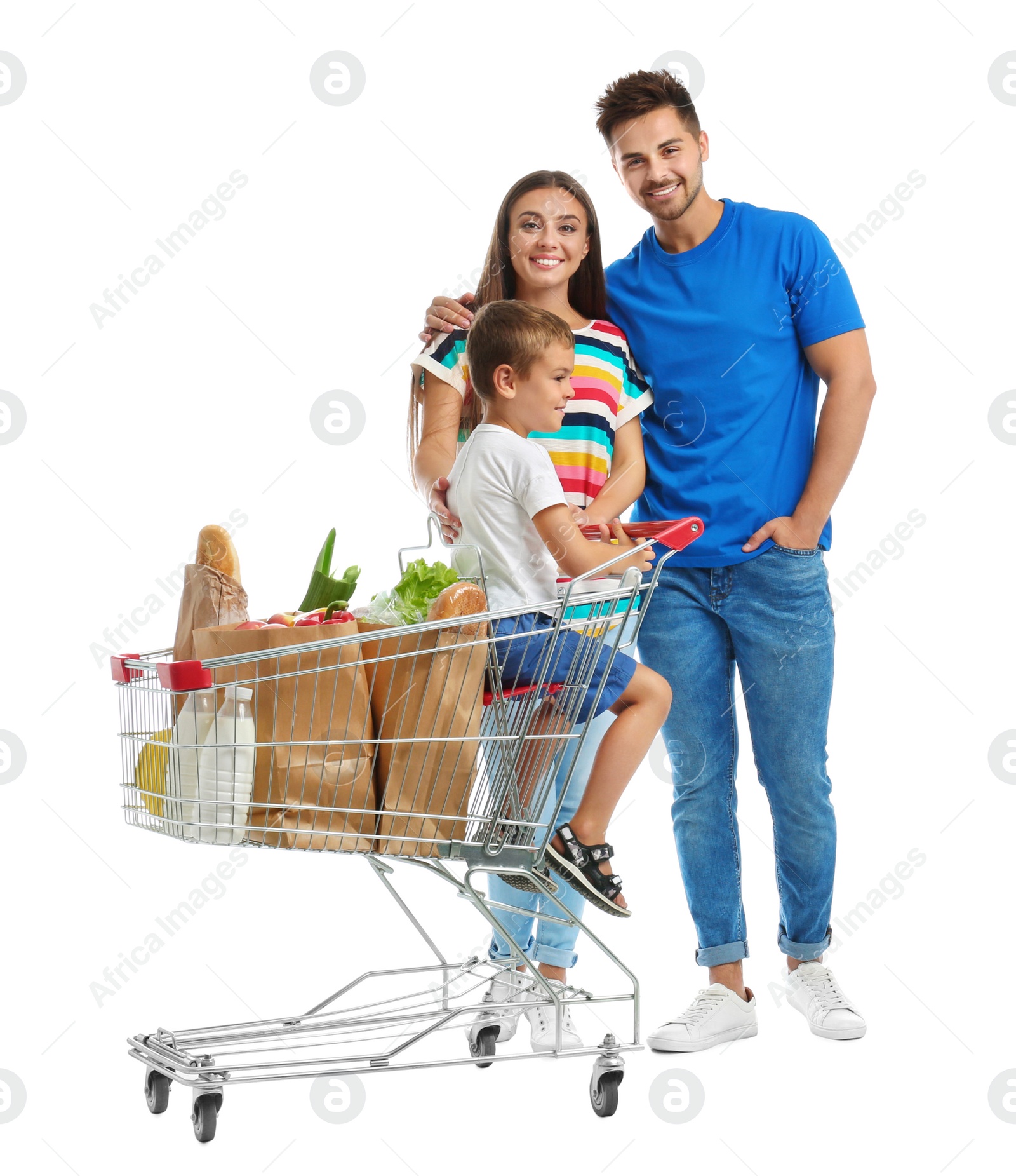 Photo of Happy family with shopping cart on white background