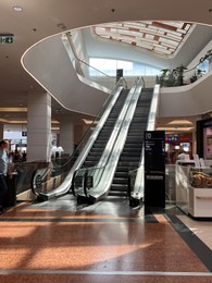 Photo of Warsaw, Poland - July 18, 2022: Shopping mall Westfield Arkadia with modern escalators