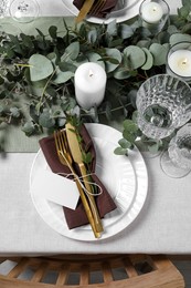 Luxury table setting with beautiful decor and blank card, flat lay. Festive dinner