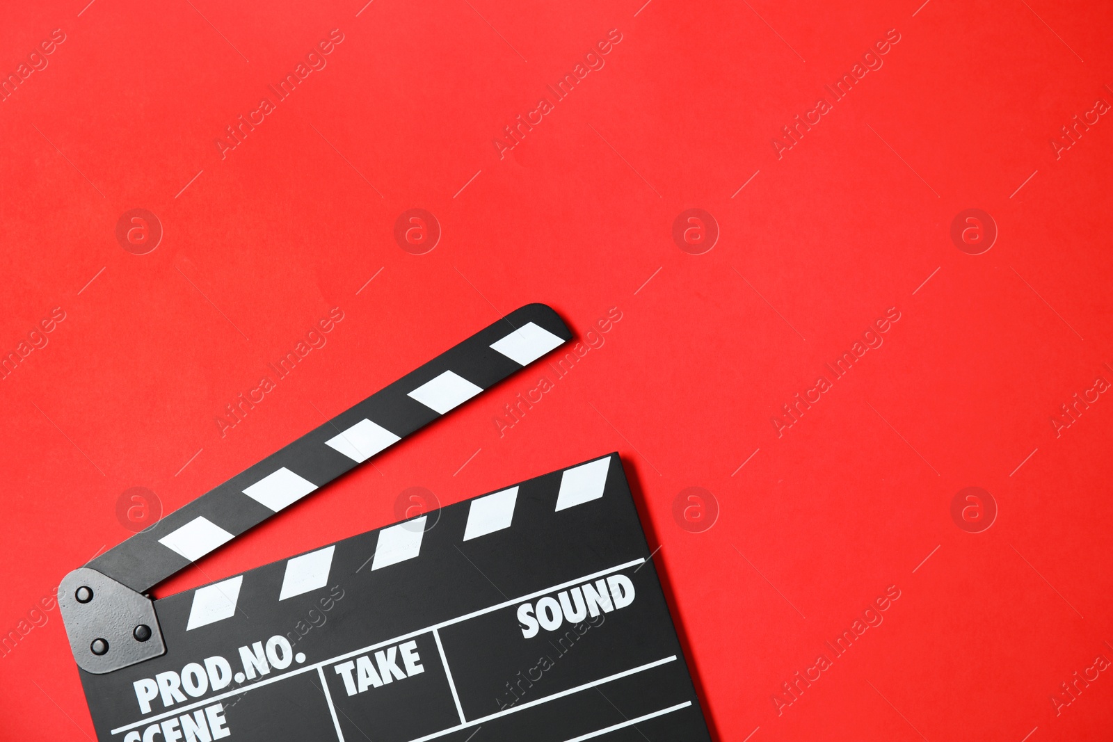 Photo of Clapperboard on color background, top view with space for text. Cinema production