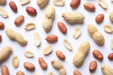 Photo of Fresh peanuts on white background, flat lay