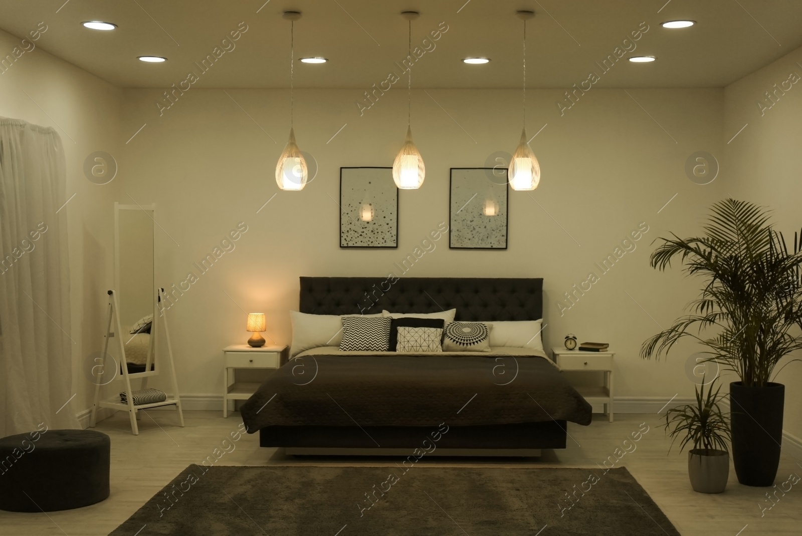 Photo of Stylish room interior with large comfortable bed