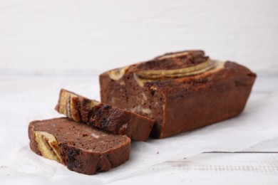 Delicious banana bread on white wooden table