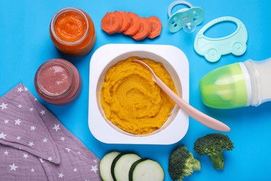 Photo of Flat lay composition with healthy baby food on light blue background