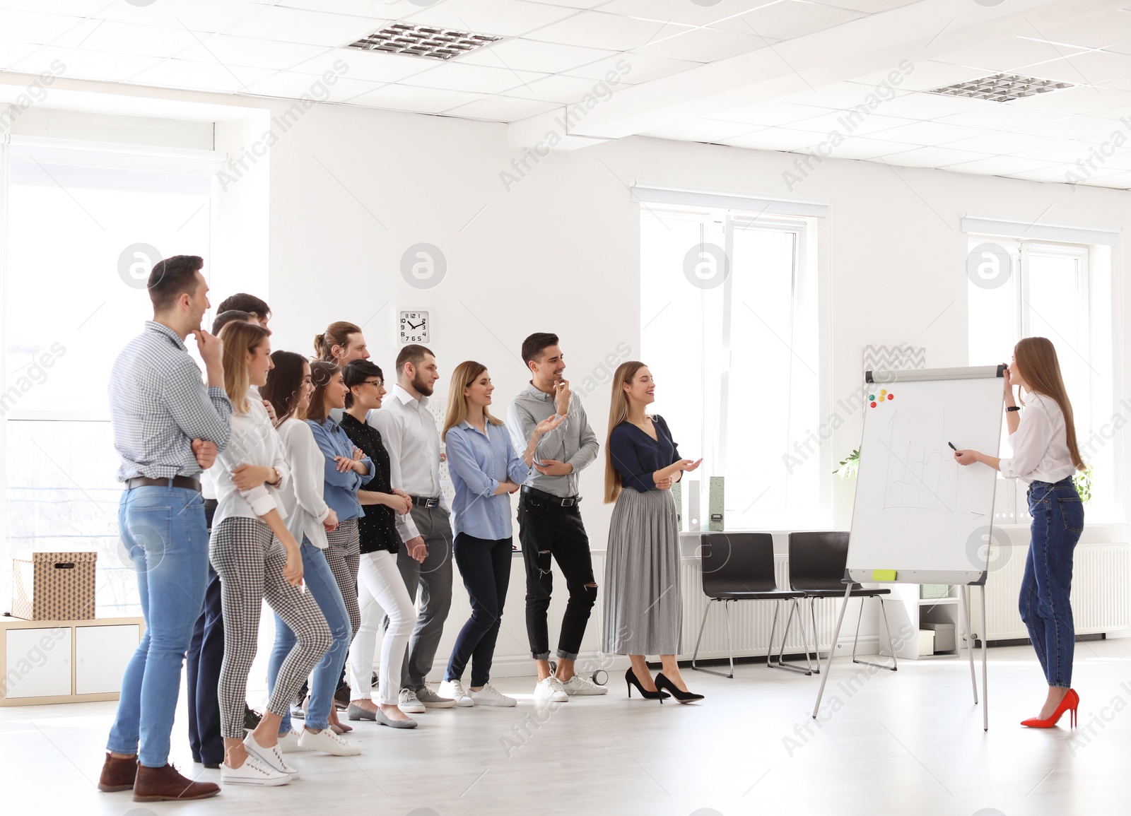 Photo of Female business trainer giving lecture in office