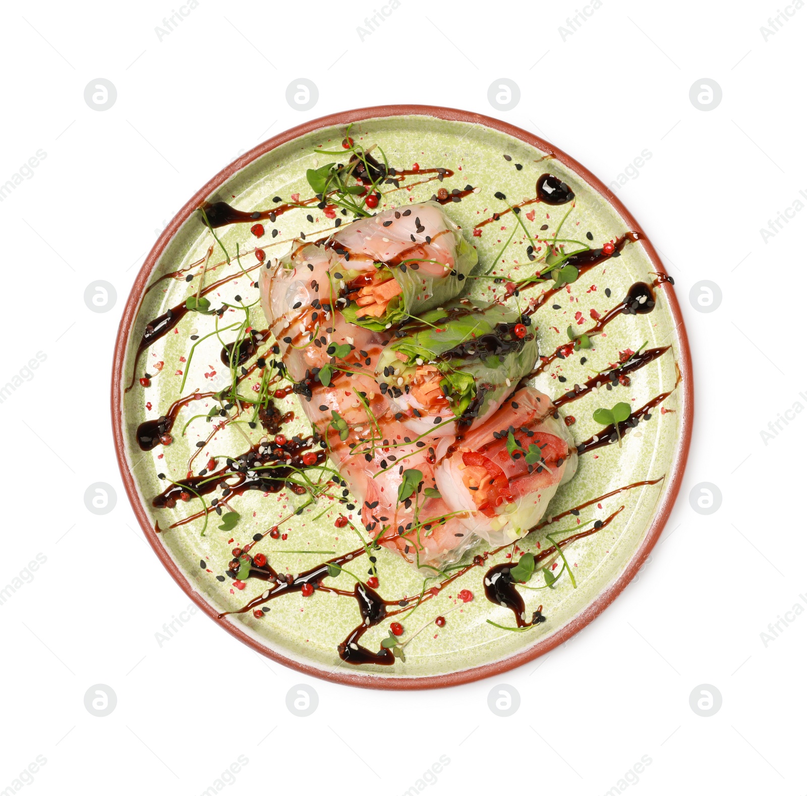 Photo of Plate of delicious spring rolls with sauce and microgreens isolated on white, top view