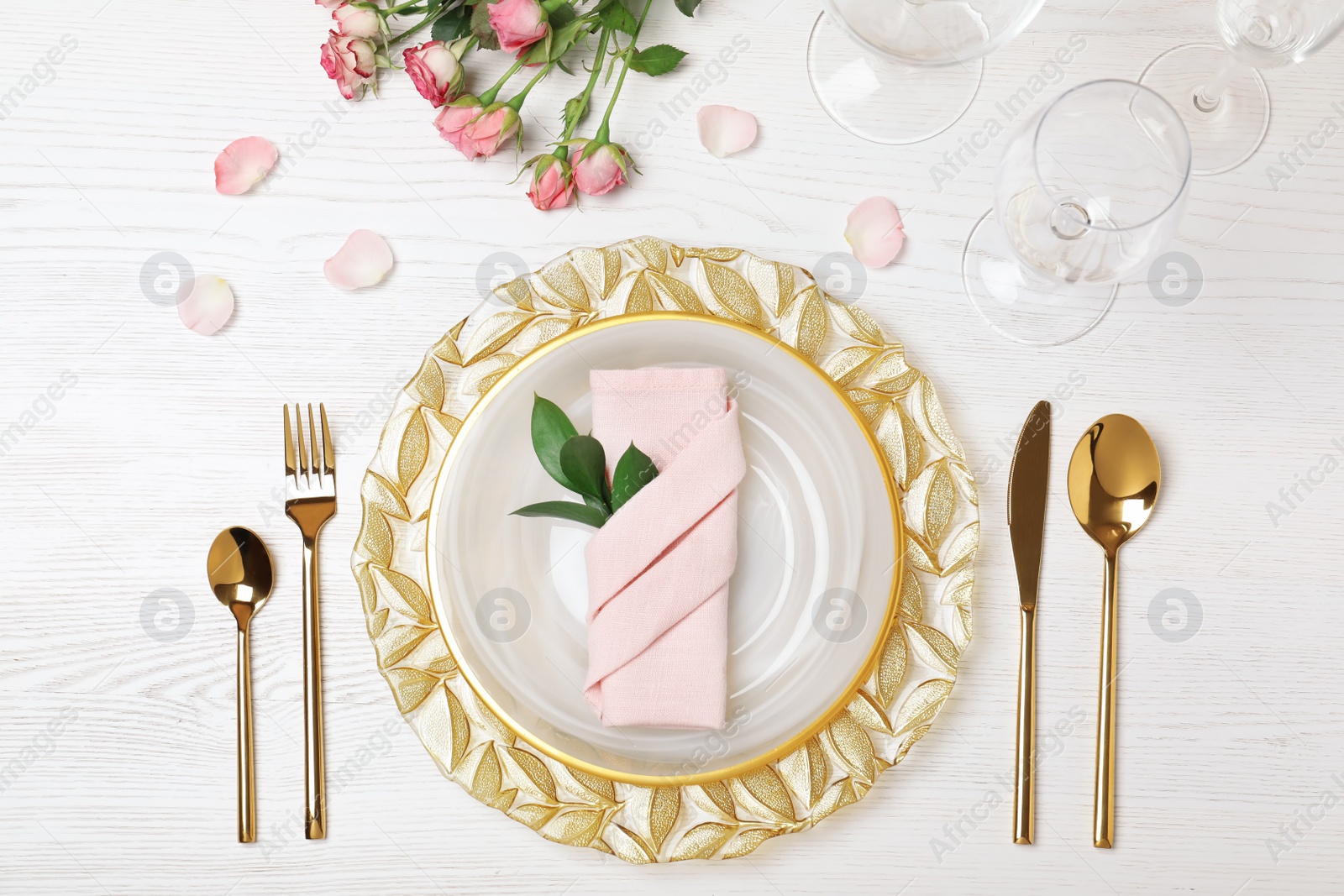 Photo of Festive table setting with plates, cutlery and napkin on wooden background, flat lay