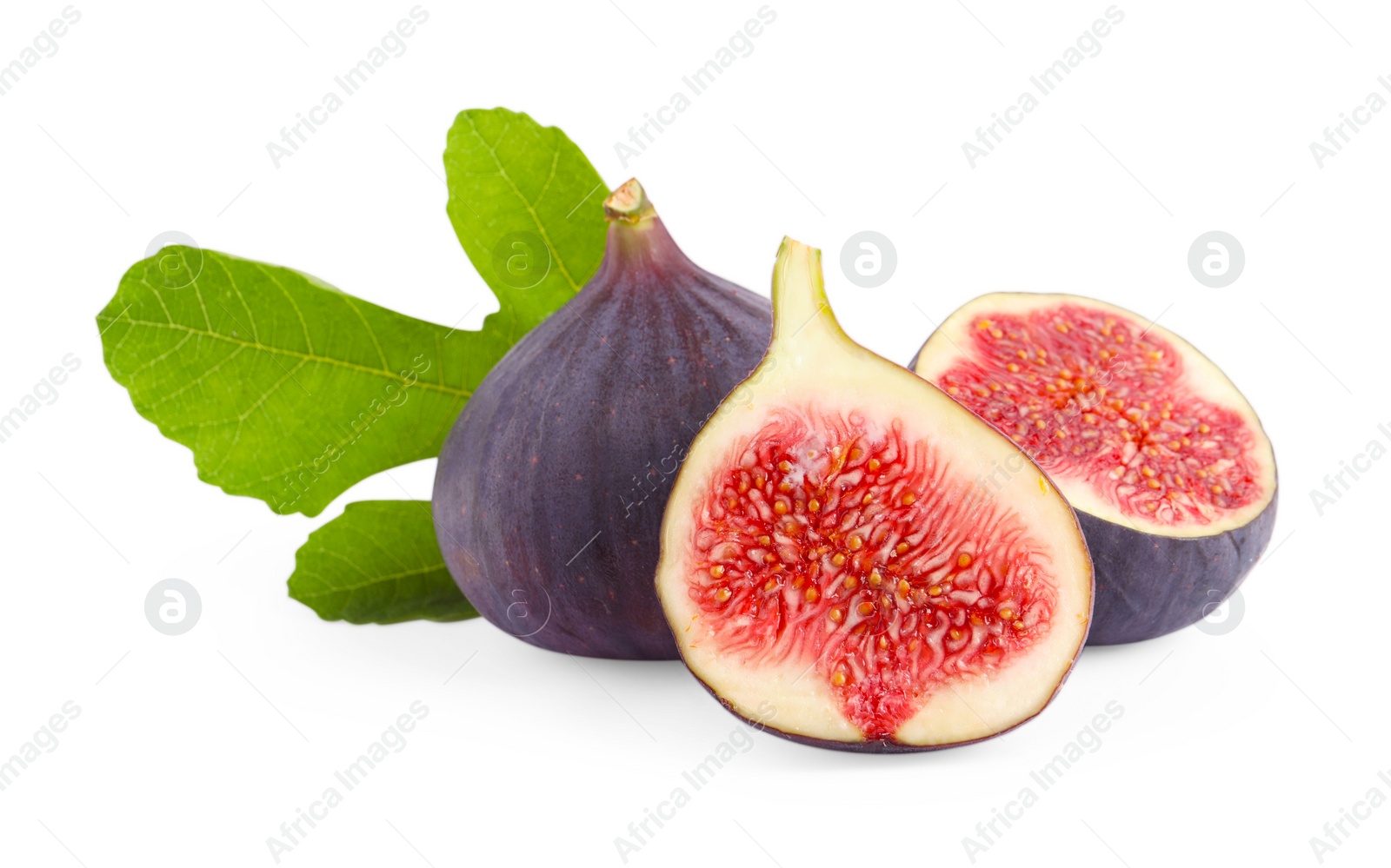 Photo of Whole and cut ripe figs with green leaf isolated on white