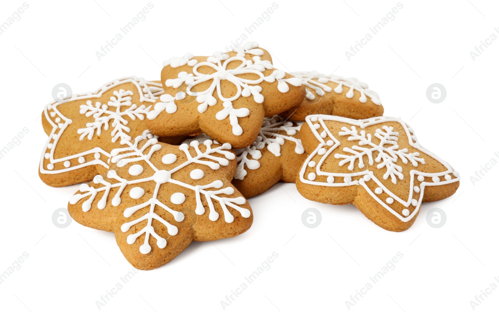 Photo of Tasty star shaped Christmas cookies with icing isolated on white