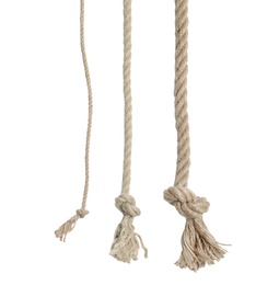 Different cotton ropes with knots on white background