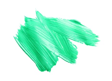 Abstract brushstroke of green paint isolated on white