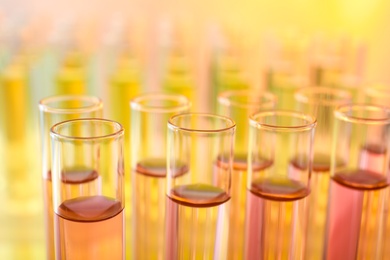 Closeup view of many test tubes with liquid, color tone effect