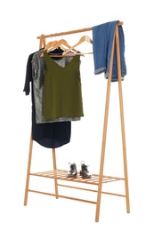 Photo of New wardrobe rack with stylish lady's clothes and shoes on white background