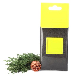 Photo of Scented sachet, pine cone and fir branch on white background