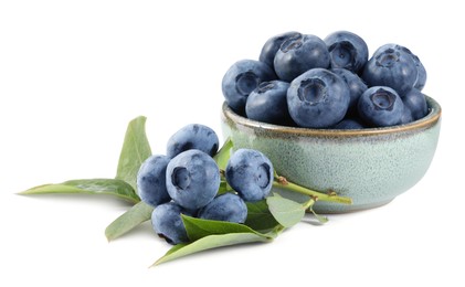 Photo of Fresh ripe blueberries and leaves isolated on white