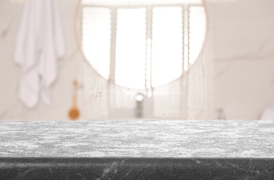 Empty table and blurred view of stylish bathroom interior