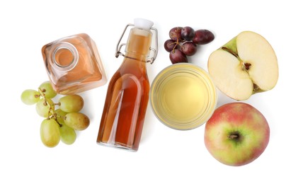 Photo of Different types of vinegar and ingredients isolated on white, top view