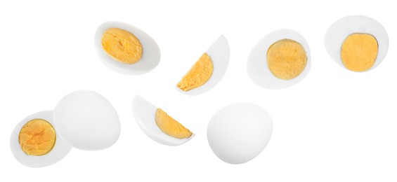 Image of Tasty hard boiled eggs flying on white background. Banner design