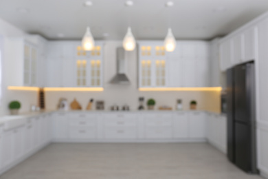 Photo of Blurred view of modern stylish kitchen interior