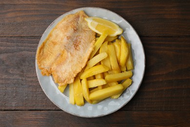 Photo of Delicious fish and chips on wooden table, top view