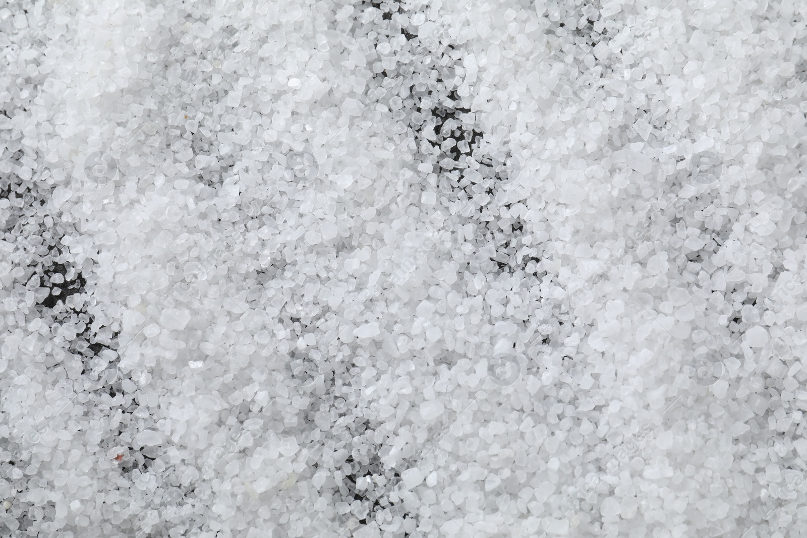 Photo of White natural salt as background, top view