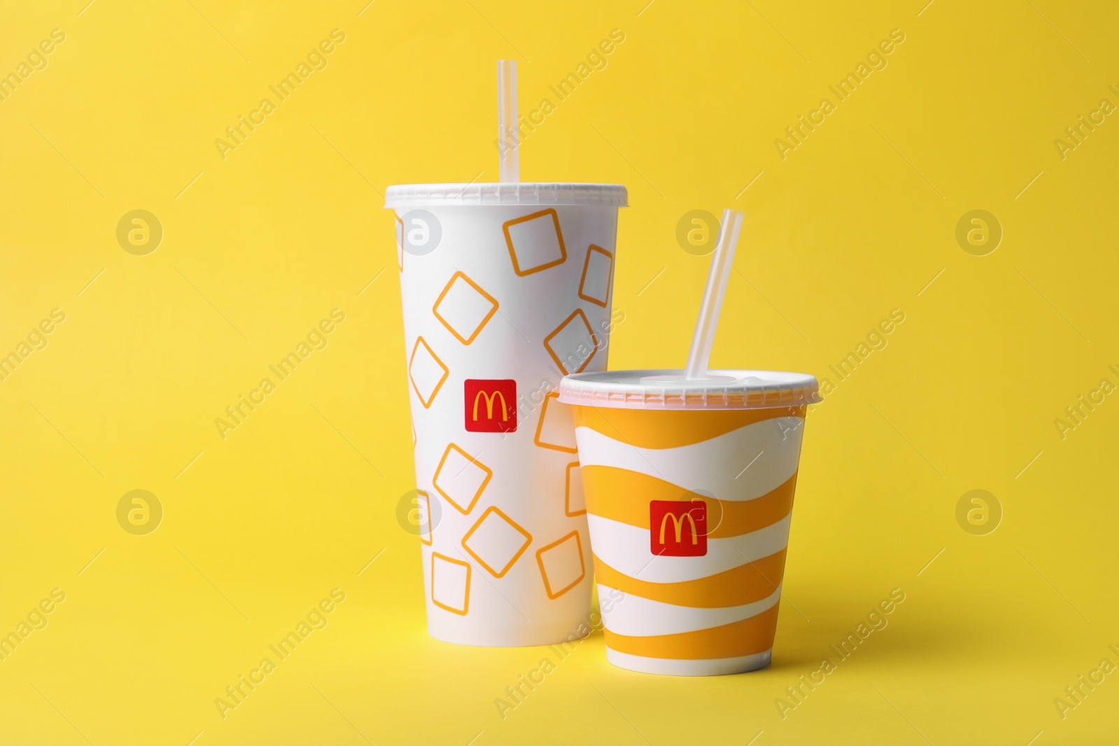 Photo of MYKOLAIV, UKRAINE - AUGUST 12, 2021: Cold McDonald's drinks on yellow background