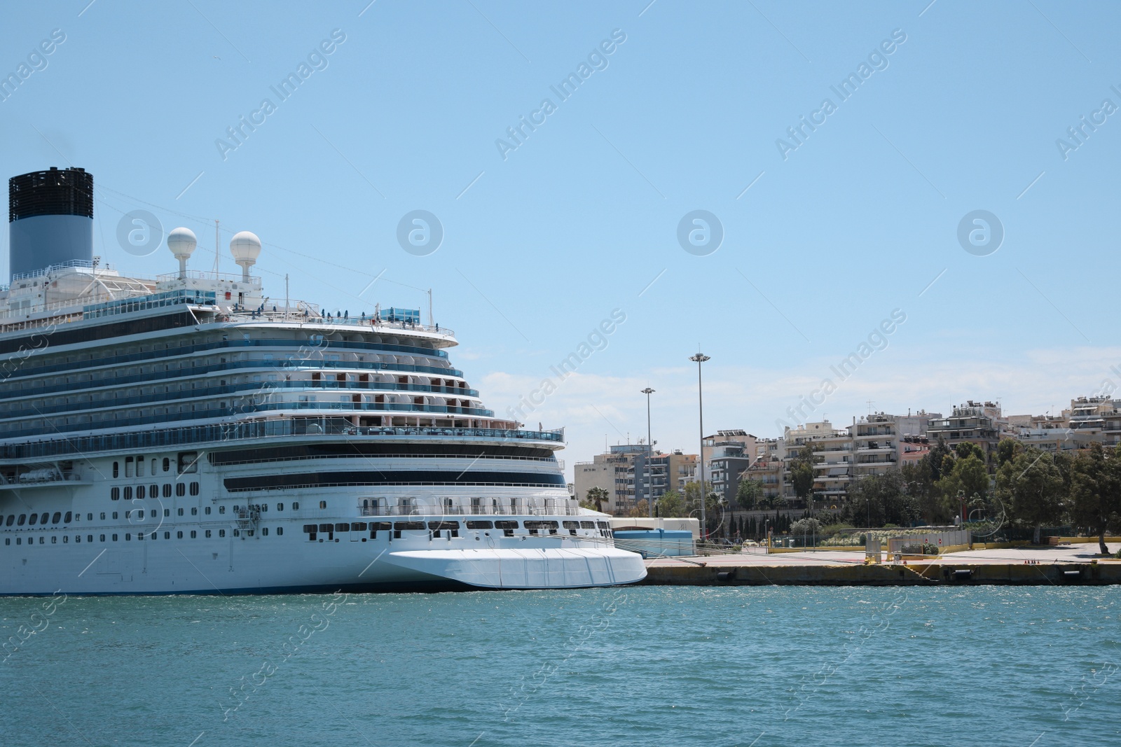 Photo of Modern cruise ship in sea on sunny day