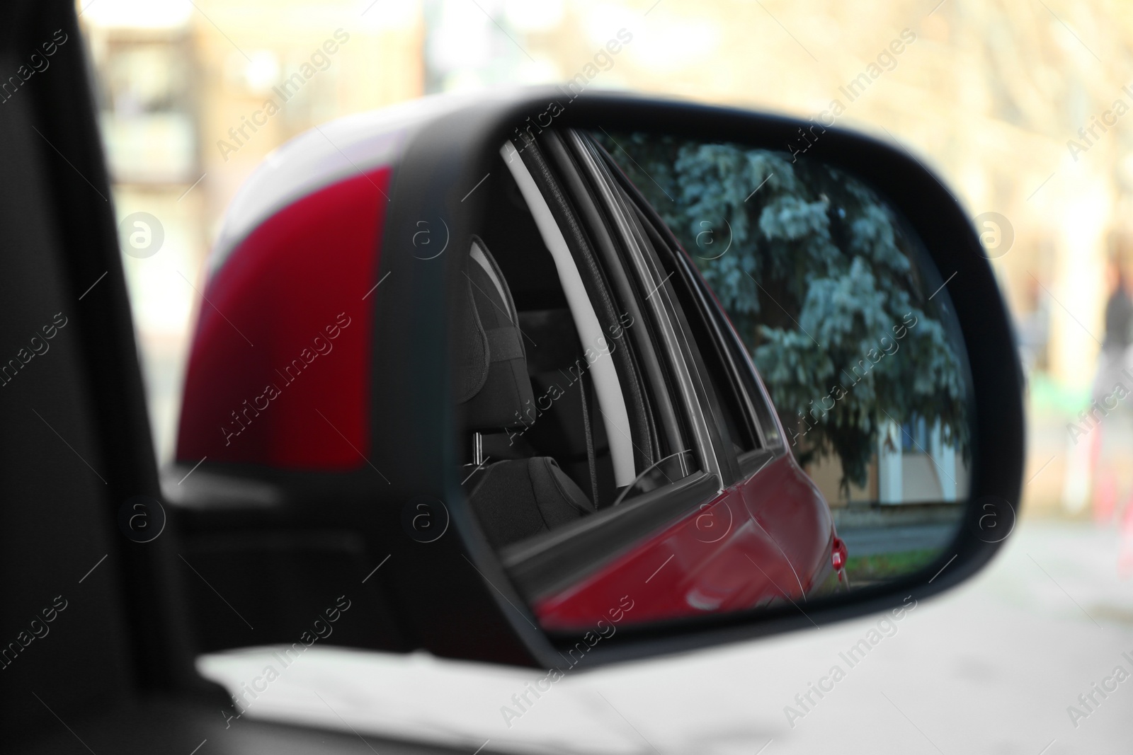 Photo of Side rear view mirror of modern car outdoors, closeup