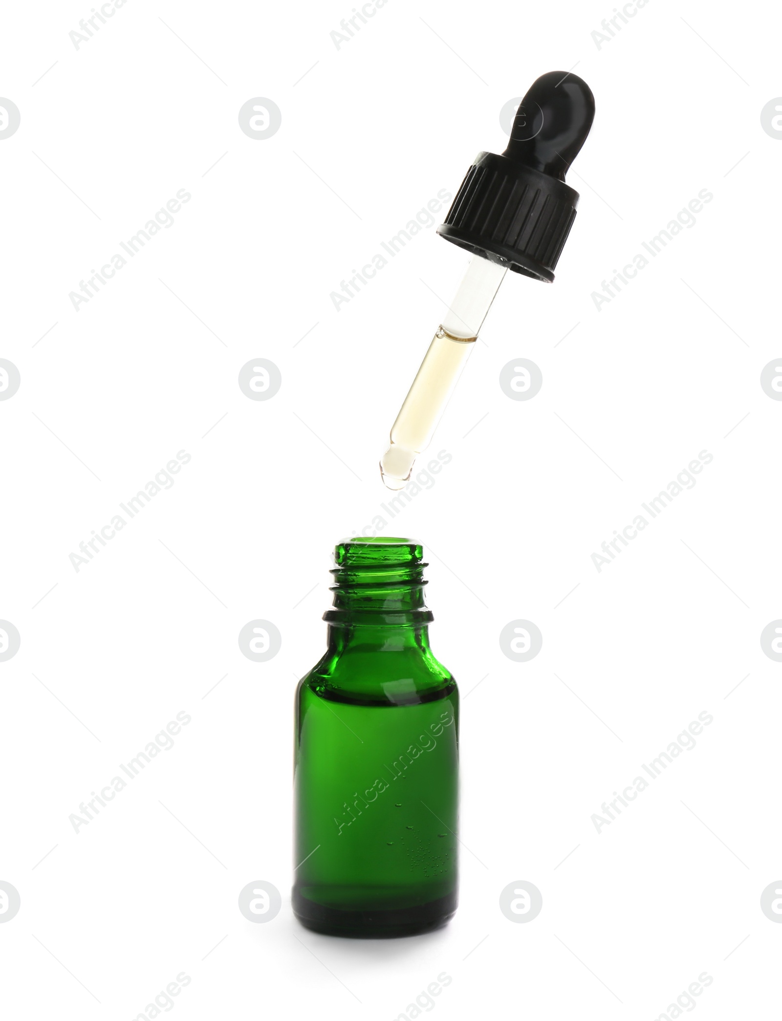 Photo of Little bottle with essential oil and dropper on white background