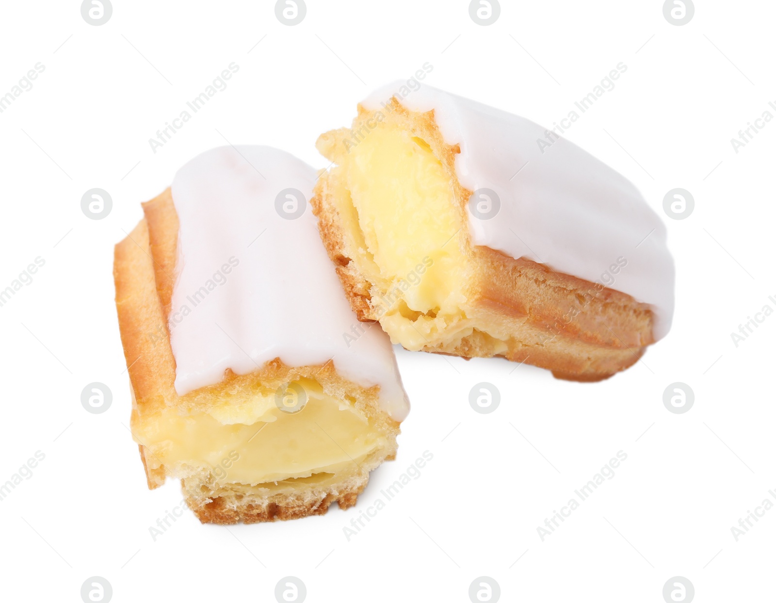 Photo of Cut delicious eclair covered with glaze isolated on white